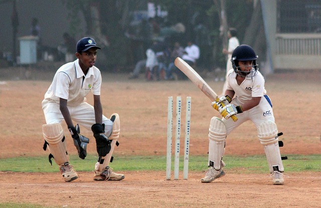 A wicketkeeper in action, ready to stump a batsman with lightning-fast reflexes.