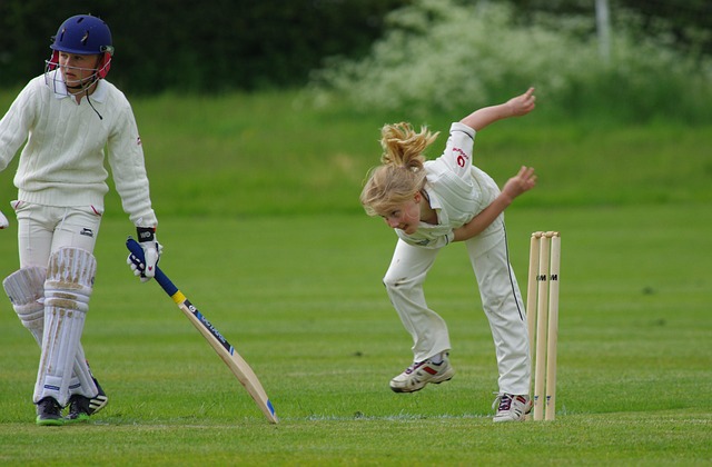 A spin bowler delivering a deceptive ball, with a focus on technique and follow-through.