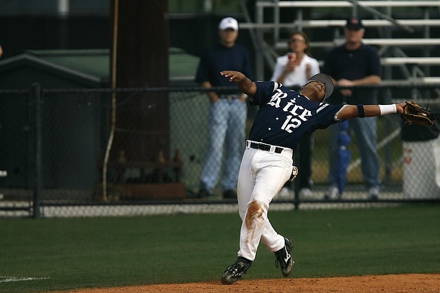Fielders collaborating to take a crucial catch in a match